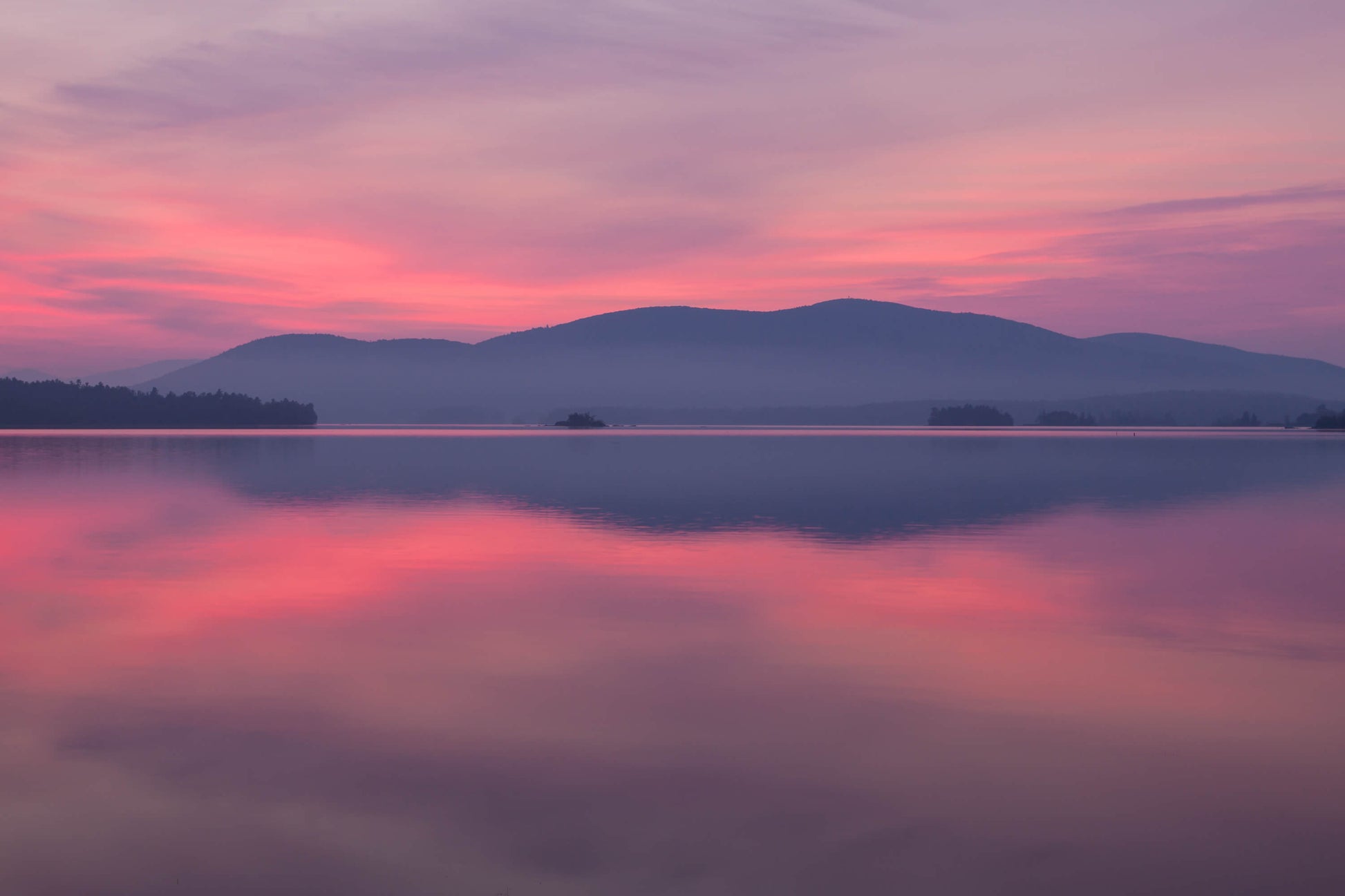 break of dawn over the mountains on Squam Lake